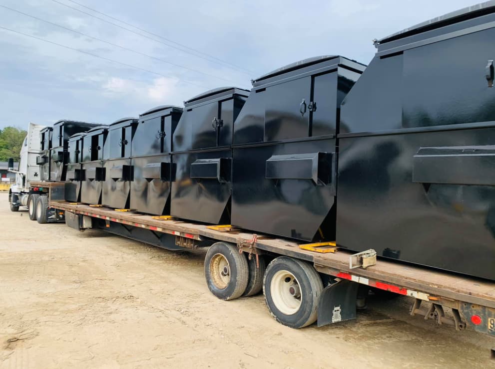 Wall Recycling dumpsters on a truck to be delivered for rentals in the Raleigh NC area