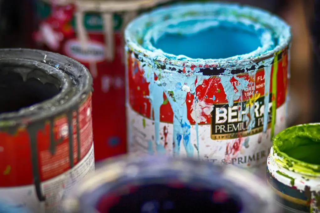 Picture of old paint cans for the blog about how to dispose of paint in North Carolina